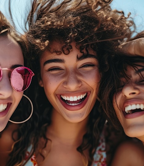 Three friends laughing together