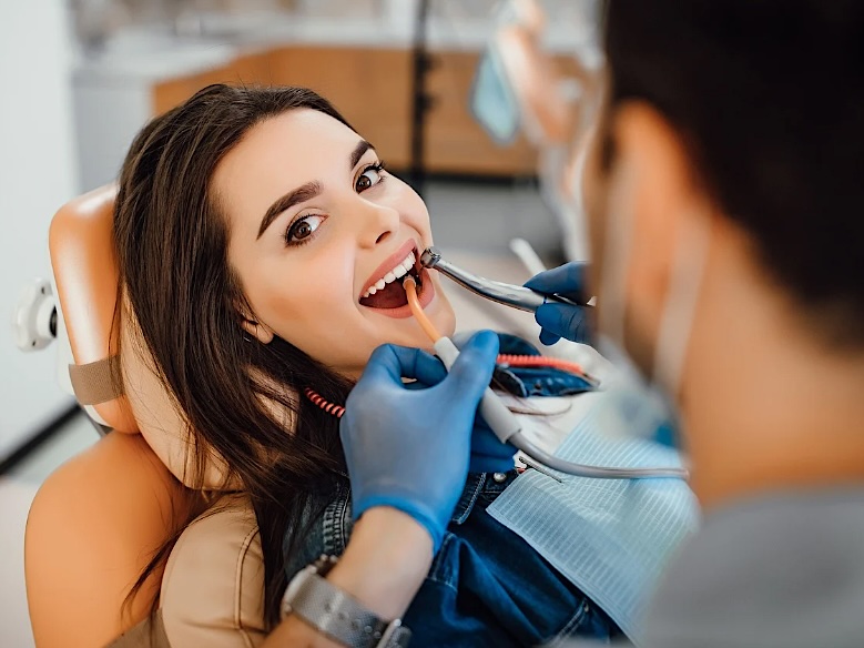 A patient smiling during a cosmetic dental visit