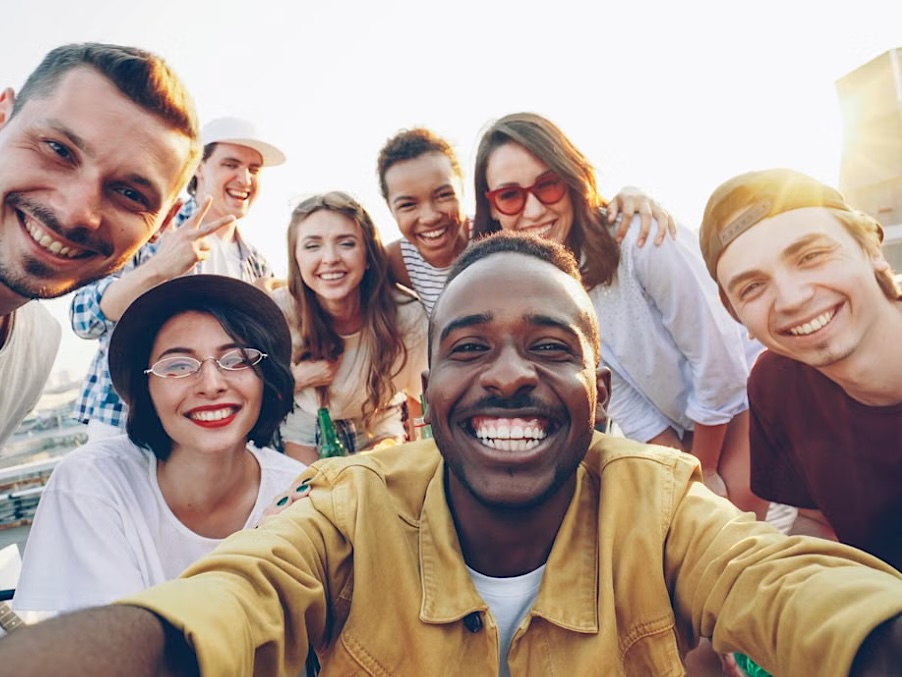 A group of friends with bright, confident smiles