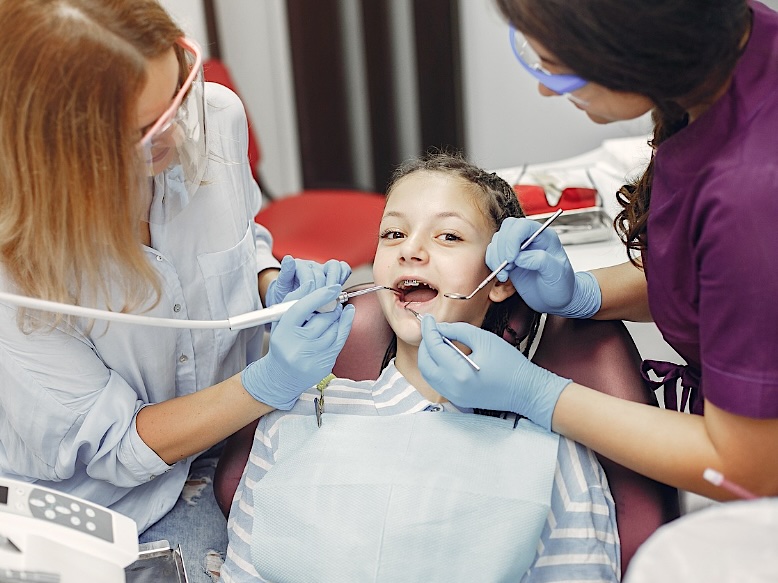 A young patient with braces during an orthodontic visit